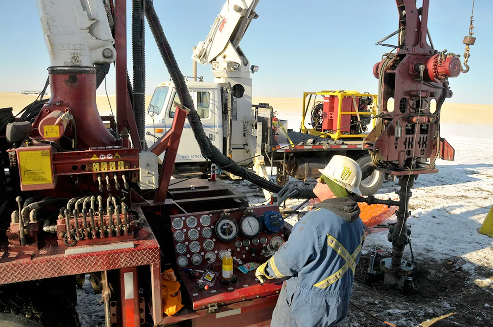 Operator working beside Edge Wireline field equipment controls